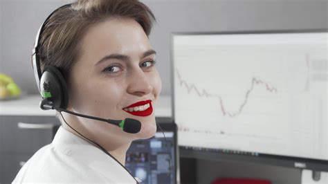 Charming Female Customer Support Agent Wearing Headset While Working Stock Video Footage