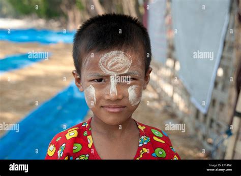A Portrait Of A Happy Smiling Young Burmese Boy With Sandalwood