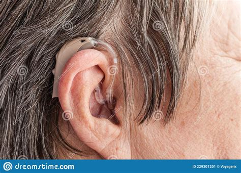Closeup Senior Woman Using Hearing Aid Stock Image Image Of Elderly Closeup 229301201