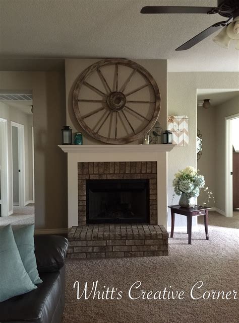 Wood wagon wheel chandelier aivengo. Wagon wheel decor. I love this look above our fireplace ...