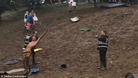 Daredevil Slides Down A Treacherous Muddy Hill In A Leeds Festival