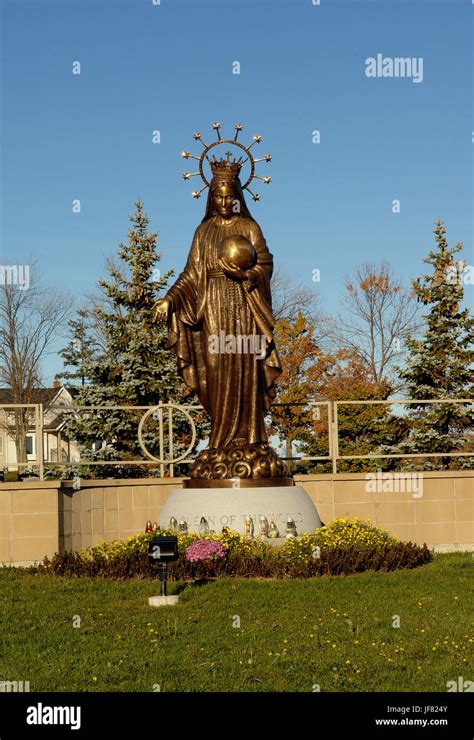 A Tall Bronze Statue Of Mother Mary Stock Photo Alamy