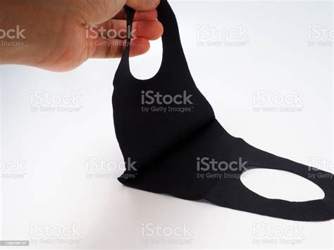 Black Non Medical Cloth Face Mask For Preventing Spreading Of Diseae Shot On A White Isolated