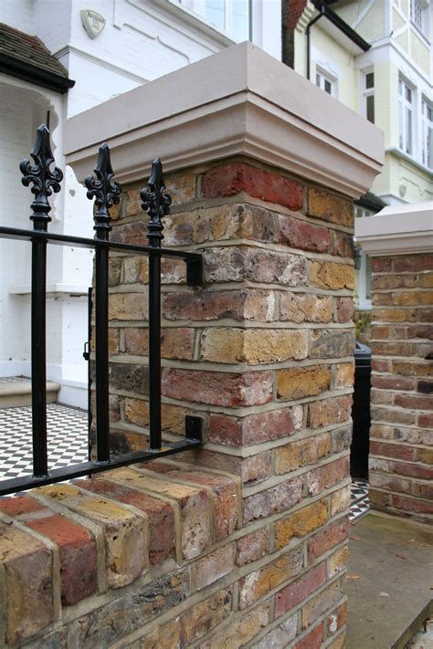 Brick Pillar And Black Railings In Contemporary London Front Garden A