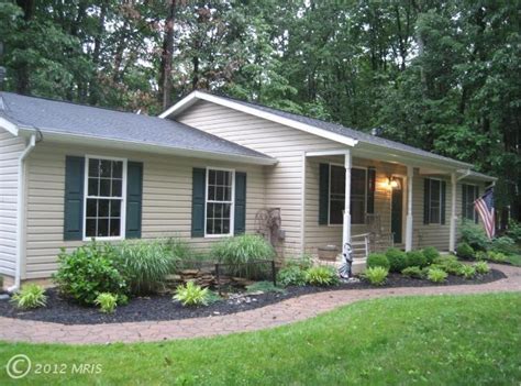 Cheerful yellow adirondack chairs bring some contrast to the front entry transitional style & flooring. 2732 CHURCH LN, TANEYTOWN, MD 21787 | ZipRealty | Ranch house landscaping, Landscape ideas front ...