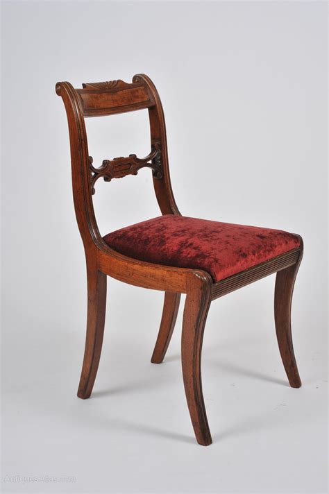 Angled side panels flank the sides of the chair's high back. Set Of 4 Regency Mahogany Sabre Leg Chairs - Antiques Atlas