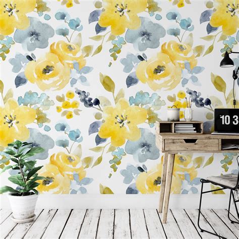A Wall With Yellow And Blue Flowers On It Next To A Wooden Table In
