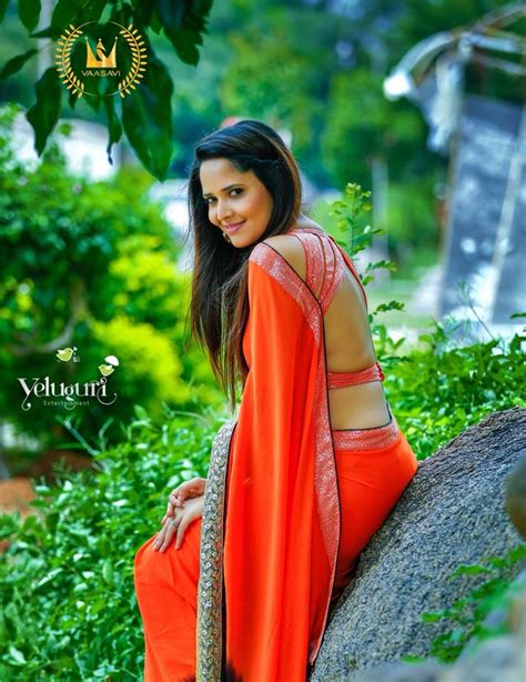 tollywood actress anasuya hot hip back show in orange saree anchor anasuya