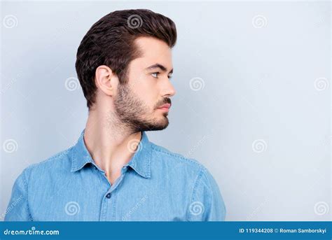 Close Up Portrait Of Serious Young Man Looking At His Left He I Stock