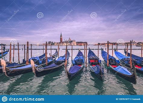 Gondolas Waiting For Tourists After Sunset In Venice Stock Image