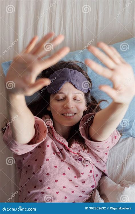 Happy Woman In Bed Wakes Up Person In Sleep Mask Stretches Her Arms Up