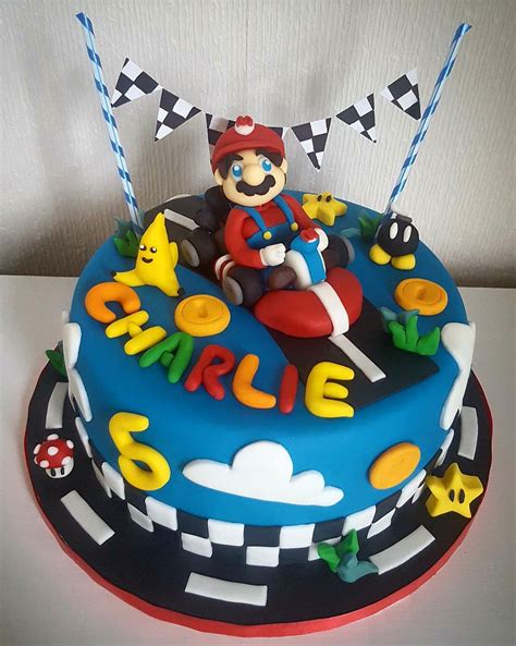 Chocolate cake and chocolate cupcakes with a go kart theme. Mario kart birthday cake www.chic-dreams.co.uk (With ...
