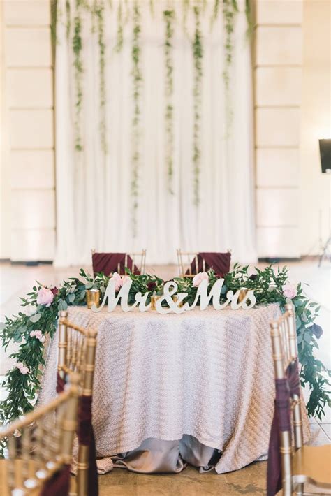 The Perfect Blush And Burgundy Sweetheart Table For The Bride And Groom