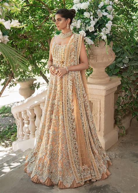 Elegant Designer Pakistani Bridal Dress In Heavily Embroidered Traditional Lehenga Enhanced With