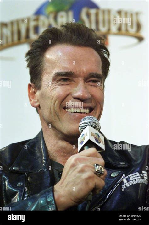 Hollywood Actor Arnold Schwarzenegger Smiles As He Answers Reporters