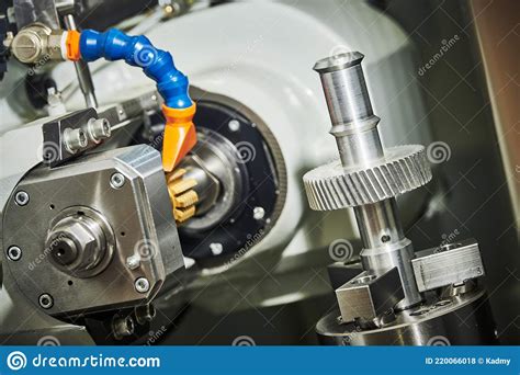 Metalworking Gear Wheel Machining With Hob On Cnc Machine Stock Photo