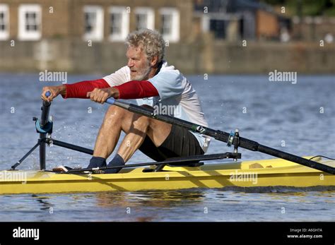 Male Man Rower Rowing A Single Scull On River Thames At Hammersmith