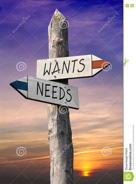 Wants and needs signpost stock photo. Image of wooden - 75798516