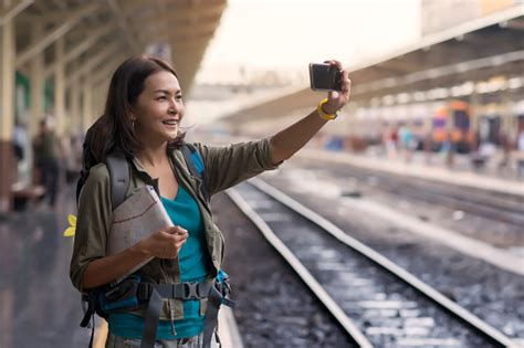 Asia Woman With Backpack And Map She Taking Photo With Smartphone At