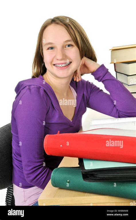 Happy Teenage Girl Studying At The Desk Stock Photo Alamy