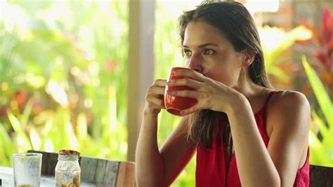 Pretty Woman Drinking Tea Relaxing By Table In Garden Stock Footage