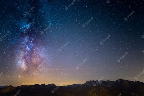 Premium Photo The Colorful Glowing Milky Way And The Starry Sky Over