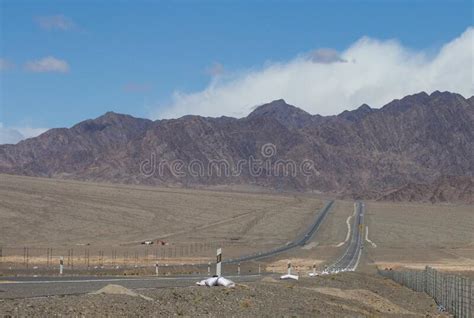 Mountains And Grasslands Stretch By Road In Qinghai Stock Photo Image