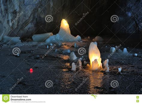 Ice Stalagmites Illuminated By Candles Inside The Marble Mine Stock
