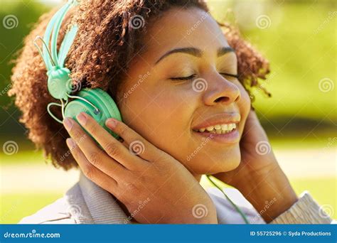 African Woman In Headphones Listening To Music Stock Photo Image Of