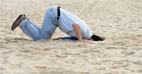 Man Buried In Sand Stock Photos Pictures And Royalty Free Images Istock