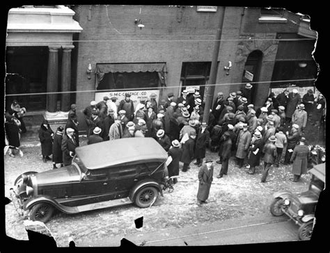 a crowd outside the clark street garage owned by george “bugs” moran where the st valentine s