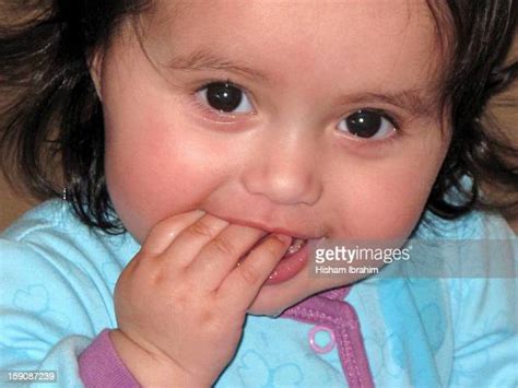 Baby Biting Hand Photos And Premium High Res Pictures Getty Images