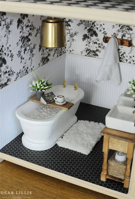 A Doll House Bathroom With Black And White Wallpaper