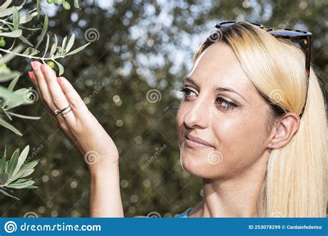 Blonde Girl Touches Olives On The Tree Stock Image Image Of Fresh