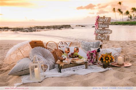 proposing at the romantic sunset beach picnic in oahu hawaii