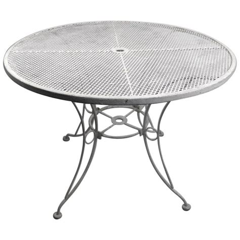 For more details or to shop this woodard 48 in. Round Garden Patio Wrought Iron Dining Table at 1stDibs