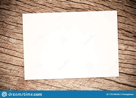 White Paper On Rustic Wood Background Mock Up Photo Paper On The