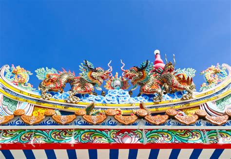 Chinese Dragon Decoration On The Roof Against Blue Sky Stock Photo