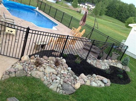 Ive Landscaped Around Our Pool With Rocks And A River Of Mulch That