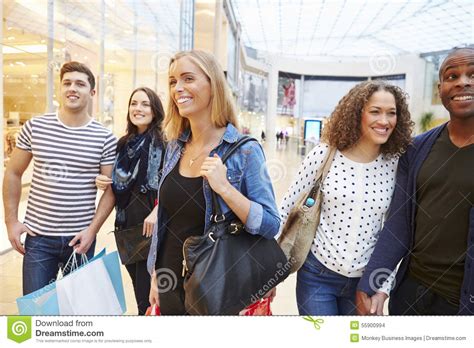 Group Of Friends Shopping In Mall Together Stock Photo Image Of Busy
