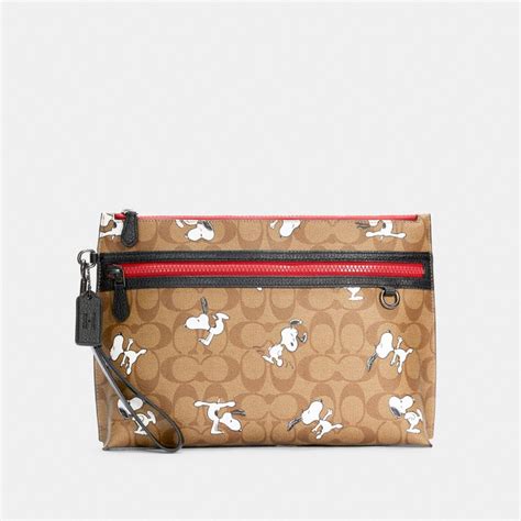 Coach® Outlet Coach X Peanuts Carryall Pouch In Signature Canvas With