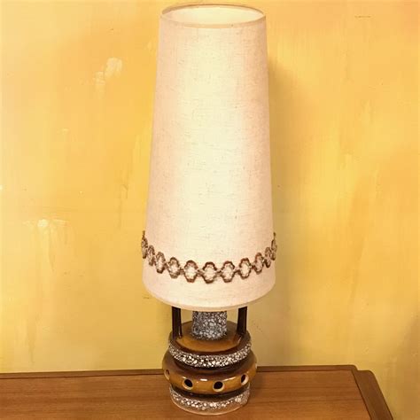 Furniture of the 1970s was full of bright colors, lava lamps, flares and flower power. 1970s Retro Lava Glazed Table Lamp with Original Shade ...