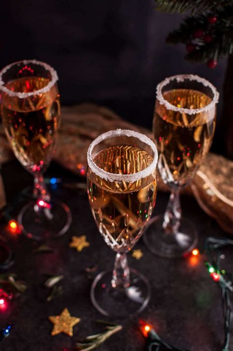 Find the perfect couple drinking champagne christmas stock photo. Christmas Pear Champagne Cocktail • Salt & Lavender