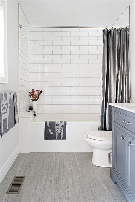 Blue Grey Bathroom Vanity With White Subway Tiles And Whimsical Accessories Grey Bathroom