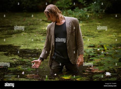 Man Standing In Swamp Stock Photo Alamy