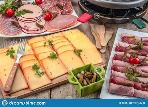 Raclette Cheese And Cold Meats Stock Image Image Of Board Table