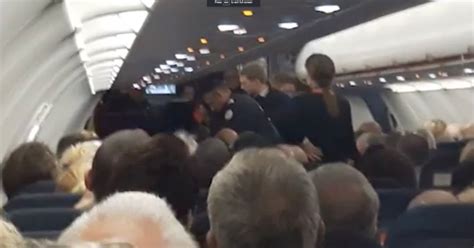 Moment Police Escorting Disruptive Easyjet Passenger Off Flight