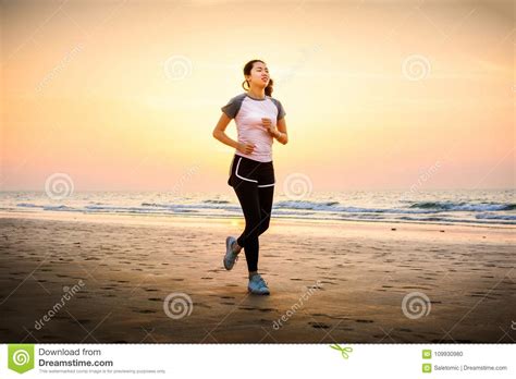 Girl Running On The Beach At Sunset Stock Photo Image Of Active