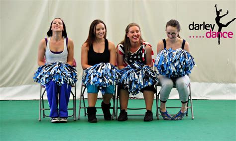 Cheerleaders Looking Relaxed Comefortable And Having A Laugh With Each