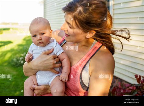 Mother Holding Her Baby Son Stock Photo Alamy